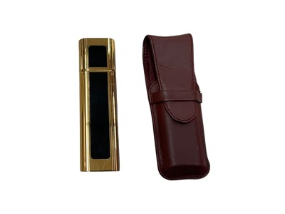Lot 2539 - Cartier atomiser in maroon leather pouch