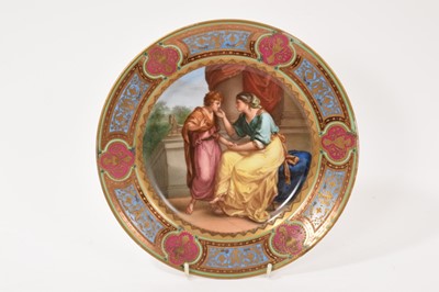 Lot 214 - Vienna porcelain cabinet plate depicting Phaedra and Hippolytus, with ornate and raised gilt decoration, titled and factory marks to reverse, 24.2cm in overall diameter.
