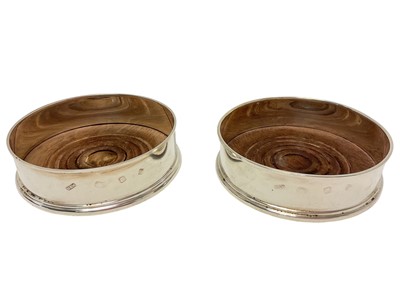 Lot 374 - Pair of contemporary silver wine coasters