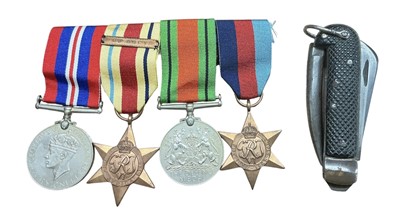 Lot 701 - Second World War Medal Group comprising 1939-1945 Star, Africa Star, Defence and War medals (mounted on bar), together with a Second World War British Army clasp knife dated 1942.