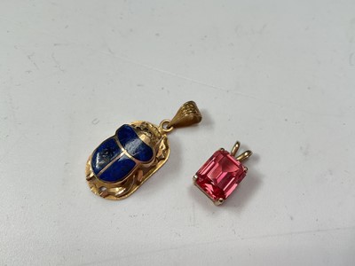 Lot 48 - Egyptian yellow metal and enamel scarab beetle pendant, 14k gold mounted pink stone pendant and a cultured pearl single string necklace with 14k clasp (3)