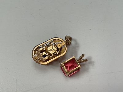 Lot 48 - Egyptian yellow metal and enamel scarab beetle pendant, 14k gold mounted pink stone pendant and a cultured pearl single string necklace with 14k clasp (3)