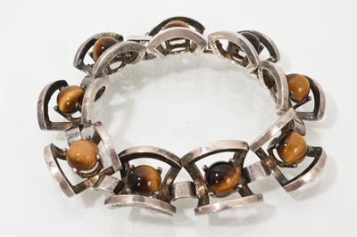 Lot 702 - 1970s silver and tiger's eye bracelet