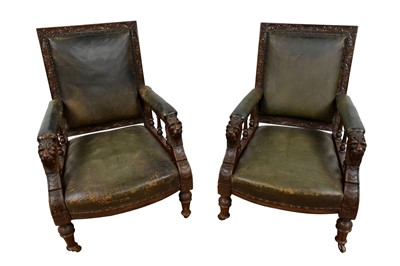 Lot 1412 - Pair of late Victorian carved oak and leather library chairs