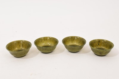 Lot 964 - Chinese Jade or green hardstone teaset comprising teapot and four tea bowls on shaped tray