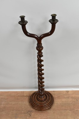 Lot 1418 - Antique mahogany and beech floorstanding twin branch candlestick
