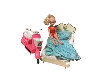 Lot 1800 - Vintage Sindy doll 33055 with wardrobe, bed and scooter, plus Charles & Diana Royal Wedding boxed dolls, Magic Roundabout soft toy and other dolls (1 box)