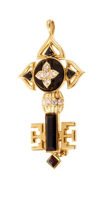 Lot 617 - Cartier diamond black onyx and gold pendant / brooch in the form of a key, signed Cartier