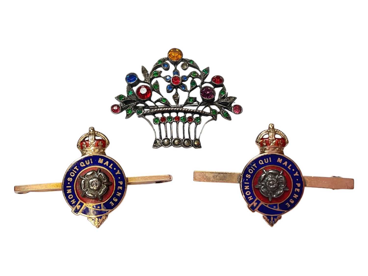 Lot 41 - Pair of gold enamelled bar brooches, both with makers mark BN, and a paste set white metal floral brooch (3)