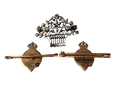 Lot 41 - Pair of gold enamelled bar brooches, both with makers mark BN, and a paste set white metal floral brooch (3)