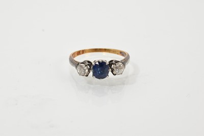 Lot 623 - Diamond and sapphire three stone ring