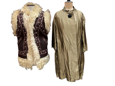 Lot 2524 - 1960s embroidered sleeveless Afghan jacket, early 1960s gold lurex evening coat, one large black button fastening and 3/4 sleeves. Plus a pair of 1960s size 6 gold stiletto shoes with pointe...