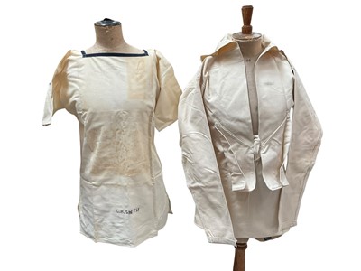 Lot 2535 - WW2 Sailors' uniform items including navy blue serge top and wide trousers, Tropical uniform including two pairs of