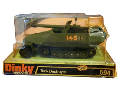 Lot 1719 - Dinky Toys diecast military vehicles including Tank Destroyer (bubble damaged) ~ 694, Striker Anti-Tank Vehicle ~ 691, Leopard Anti-Aircraft Tank ~ 696 and Milatary Hovercraft ~ 281, all on card...