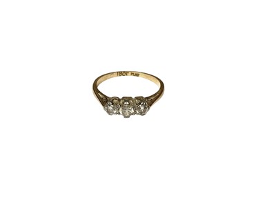 Lot 125 - Diamond three stone ring in platinum setting on 18ct gold shank, size J