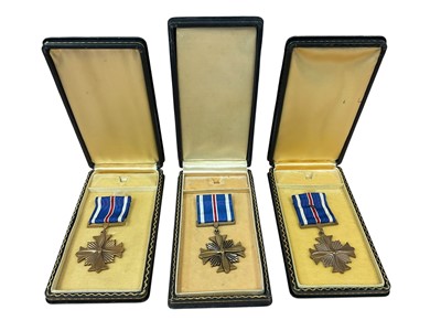 Lot 772 - Three American Distinguished Flying Cross medals in 'coffin boxes', (3).