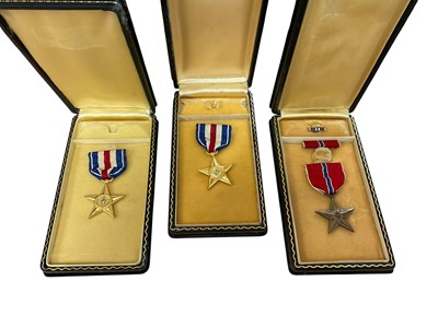 Lot 790 - Two American Silver Star medals together with a Bronze Star medal, all in 'coffin boxes', (3).