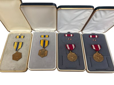 Lot 794 - Group of four American medals in boxes to include two Meritorious Service medals and two Air Force Commendation medals (4)