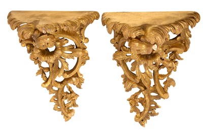 Lot 1446 - Pair of 18th / 19th century Rococo carved giltwood wall brackets
