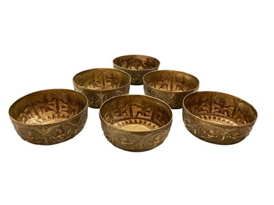 Lot 167 - Set of five Indian embossed brass bowls and one other similar (6)