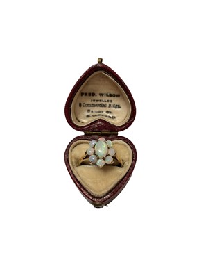 Lot 82 - Opal flower head cluster ring in 9ct gold setting, size M½, in a Victorian heart shaped ring box
