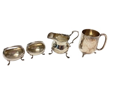 Lot 361 - Silver christening mug, silver cream jug and a pair of silver bon bon baskets/salts