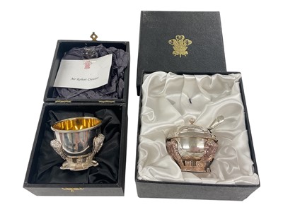 Lot 63 - H.R.H. Prince Charles, Prince of Wales, two Royal Christmas gifts comprising silver plated salt and mustard pot with cover and spoon with cast Prince of Wales feather crest decoration to bases in...