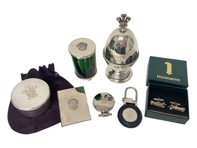 Lot 65 - H.R.H. Prince Charles Prince of Wales, collection of six Christmas gifts comprising three scented candles in silver plated mounts, a keyring , a travelling clock and folding photograph frame all...