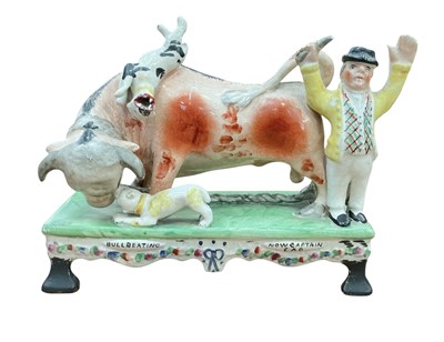 Lot 5004 - Pottery group depicting tethered bull being worried by dogs