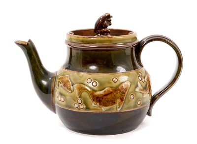 Lot 50 - George Tinworth for Doulton, Teapot with carp border and frog knop