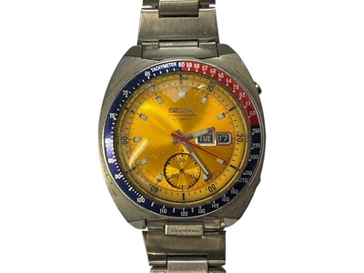 Lot 64 - 1970s Seiko Chronograph Automatic wristwatch, with circular yellow dial, day and date aperture, subsidiary seconds, red and blue 'Pepsi' bezel measuring 38mm diameter, in a stainless steel case...
