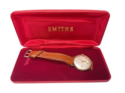 Lot 65 - 1960s 9ct gold cased Smiths Astral wristwatch (Edinburgh 1965) with engraved presentation inscription to reverse, 32mm diameter, on brown leather strap, in Smiths red case