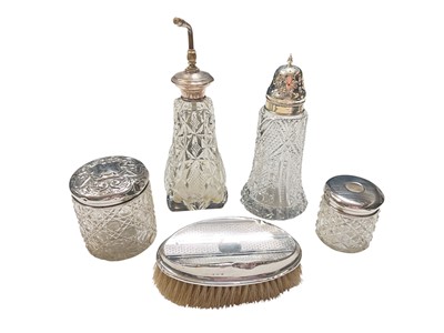 Lot 183 - Group of silver mounted glass bottles and jars, together with a silver mounted brush (5)