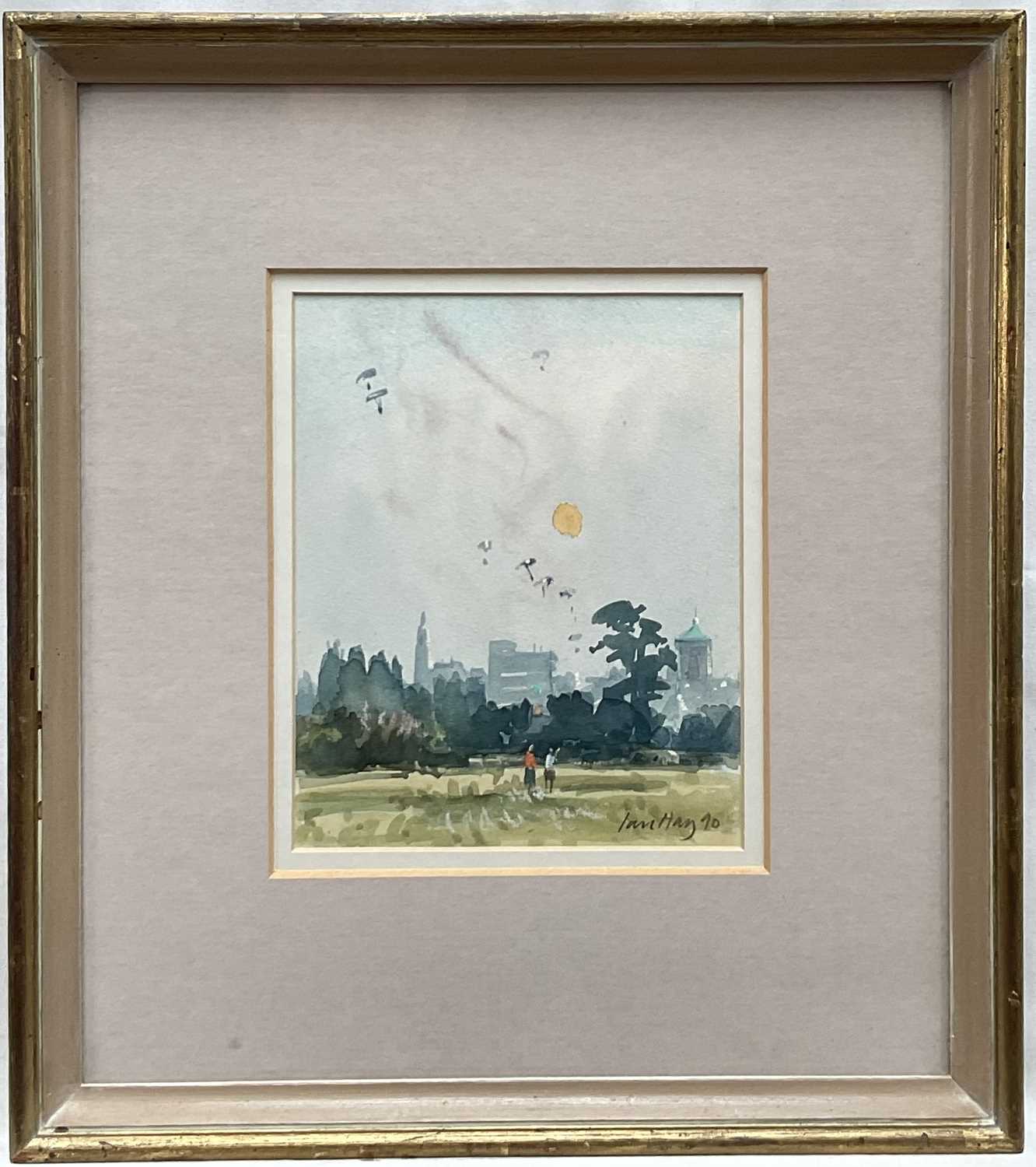 Lot 1 - Ian Hay (1940-2025) Watercolour, Parachutes overColchester Castle Park, signed and dated 1990, in glazed frame, 17cm x 13.7cm.