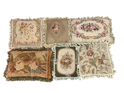 Lot 2517 - Floral embroidered tapestry and velvet cushions with tassel edging (6).