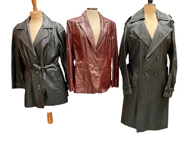 Lot 2518 - Vintage Etienne Aigner burgundy leather jacket size 18, plus Argyle long black leather coat, double breasted with belt size 18 and a Charm London black leather coat with belt.