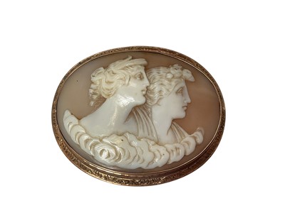 Lot 77 - 19th century carved shell cameo depicting two classical female busts in a yellow metal brooch / pendant mount
