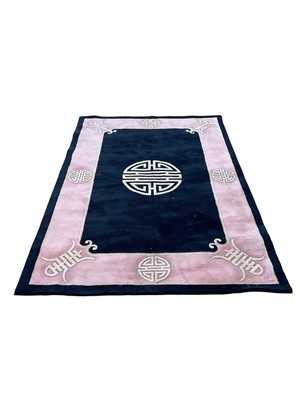 Lot 5329 - Large Chinese pink and black rug, 273cm x 182, together with two smaller Chinese rugs