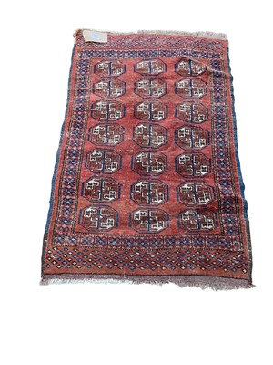 Lot 5275 - Two Eastern rugs, one on burnt orange and blue ground, 114cm x 76cm, the other on multicoloured ground, 123cm x 76cm