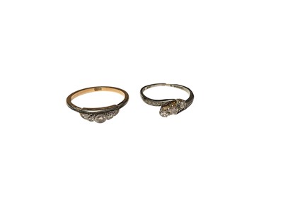 Lot 118 - Edwardian 18ct white gold diamond cross over ring and another Edwardian 18ct gold diamond ring (2)