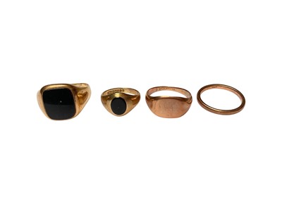 Lot 119 - Two 9ct gold and black onyx signet rings, 9ct rose gold signet ring and a 9ct rose gold wedding ring (4)