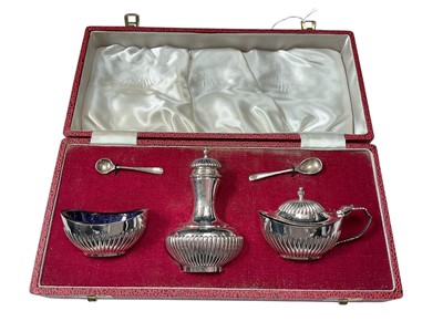 Lot 57 - 1970s silver three piece cruet set in fitted case (Sheffield 1975)
