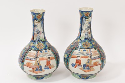 Lot 256 - Pair of late 19th century Japanese Fukugawa bottle vases, character marks to base, 29cm high