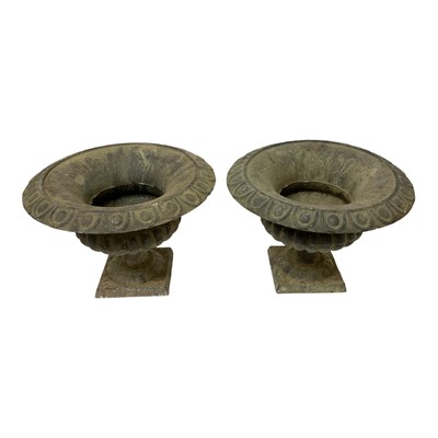 Lot 1449 - Pair of weathered cast metal garden urns
