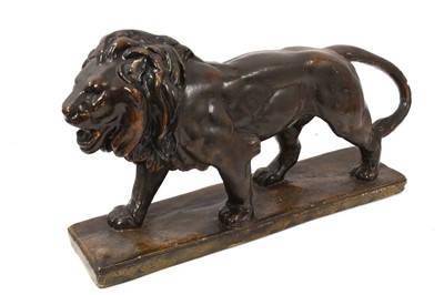 Lot 905 - Painted plaster sculpture of a prowling lion