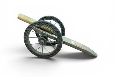 Lot 690 - Second World War French Trench Art cannon, constructed from pram wheels and a shell case, with applied plaque "Canon A Poudre 1944 Le Jeune Jean", 60.5cm in length.