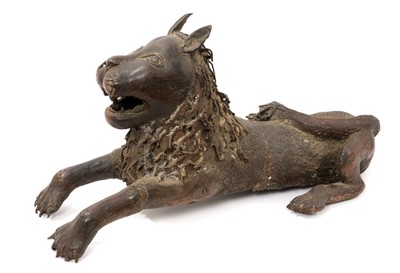Lot 927 - Charismatic Benin type bronze model of a reclining lion