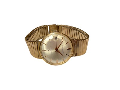 Lot 148 - 9ct gold Eterna-Matic Centenaire wristwatch with a silvered circular dial, applied baton makers and date aperture, on an articulated 9ct gold bracelet
