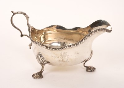 Lot 427 - Silver sauce boat with engraved crest, by Gilliam London