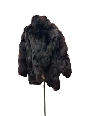 Lot 2544 - Ladies' good quality black fox fur jacket with cross-over front and one leather button, maker E Frassu, Sassari, Italy.